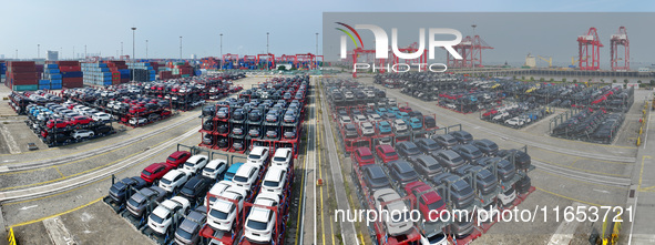 A batch of cars is about to be exported to overseas markets through frame transport at the International Container Terminal in Taicang Port...