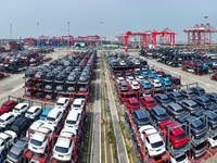 A batch of cars is about to be exported to overseas markets through frame transport at the International Container Terminal in Taicang Port...