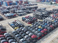 A batch of cars is about to be exported to overseas markets through frame transport at the International Container Terminal in Taicang Port...