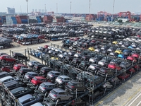 A batch of cars is about to be exported to overseas markets through frame transport at the International Container Terminal in Taicang Port...