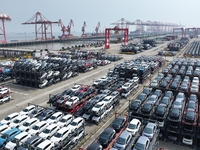 A batch of cars is about to be exported to overseas markets through frame transport at the International Container Terminal in Taicang Port...