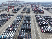 A batch of cars is about to be exported to overseas markets through frame transport at the International Container Terminal in Taicang Port...