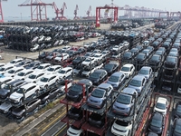 A batch of cars is about to be exported to overseas markets through frame transport at the International Container Terminal in Taicang Port...