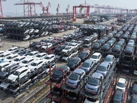 A batch of cars is about to be exported to overseas markets through frame transport at the International Container Terminal in Taicang Port...