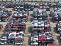 A batch of cars is about to be exported to overseas markets through frame transport at the International Container Terminal in Taicang Port...