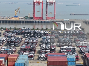 A batch of cars is about to be exported to overseas markets through frame transport at the International Container Terminal in Taicang Port...