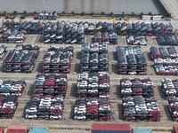 A batch of cars is about to be exported to overseas markets through frame transport at the International Container Terminal in Taicang Port...