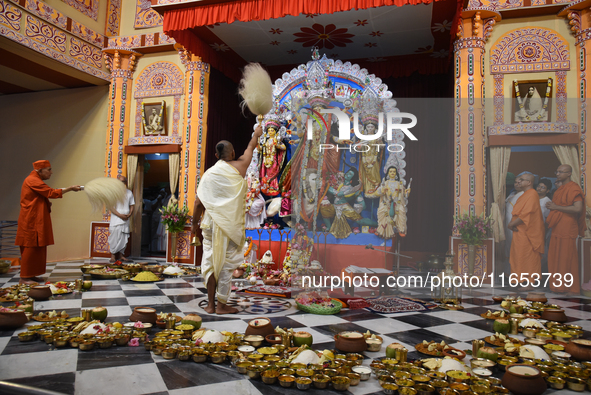 Priests of the Ramakrishna Mission perform a ritual in front of a clay image of the Hindu goddess Durga at Belur Math, about 26 kilometers n...