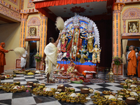 Priests of the Ramakrishna Mission perform a ritual in front of a clay image of the Hindu goddess Durga at Belur Math, about 26 kilometers n...