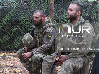 Soldiers of a 2S1 Gvozdika self-propelled howitzer crew of Ukraine's 154th Separate Mechanized Brigade are at positions in Kharkiv region, n...