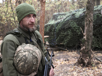 A soldier from a 2S1 Gvozdika self-propelled howitzer crew of Ukraine's 154th Separate Mechanized Brigade is at positions in the Kharkiv reg...