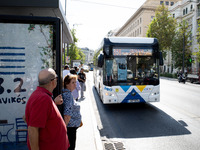 People wait for the bus in the center of Athens, Greece, on October 10, 2024. A new measure for public transportation is announced by the De...