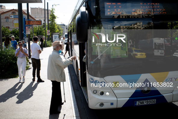 A man waits for the bus in the center of Athens, Greece, on October 10, 2024. A new measure for public transportation is announced by the De...