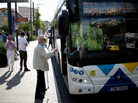 A man waits for the bus in the center of Athens, Greece, on October 10, 2024. A new measure for public transportation is announced by the De...