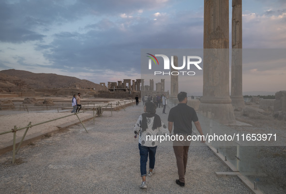 An Iranian couple visits the Persepolis historical site near the city of Shiraz in Fars province, about 932 km (579 miles) south of Tehran,...