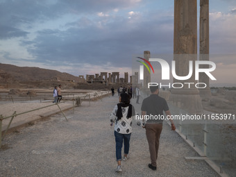 An Iranian couple visits the Persepolis historical site near the city of Shiraz in Fars province, about 932 km (579 miles) south of Tehran,...