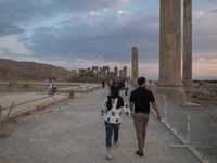 An Iranian couple visits the Persepolis historical site near the city of Shiraz in Fars province, about 932 km (579 miles) south of Tehran,...