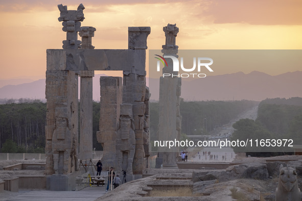 Iranian people visit the Persepolis historical site near the city of Shiraz in Fars province, about 932 km (579 miles) south of Tehran, Iran...