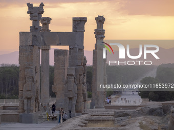 Iranian people visit the Persepolis historical site near the city of Shiraz in Fars province, about 932 km (579 miles) south of Tehran, Iran...