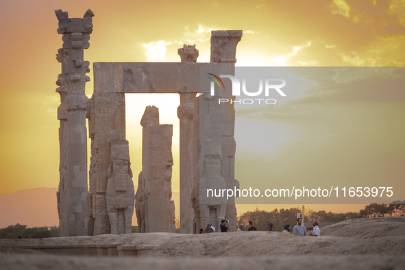 Iranian people visit the Persepolis historical site near the city of Shiraz in Fars province, about 932 km (579 miles) south of Tehran, Iran...