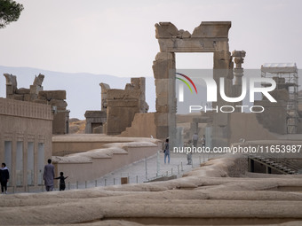 Iranian people visit the Persepolis historical site near the city of Shiraz in Fars province, about 932 km (579 miles) south of Tehran, Iran...