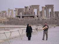 An Iranian couple visits the Persepolis historical site near the city of Shiraz in Fars province, about 932 km (579 miles) south of Tehran,...