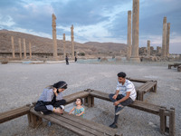 An Iranian family visits the Persepolis historical site near the city of Shiraz in Fars province, about 932 km (579 miles) south of Tehran,...