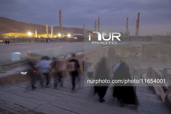 Iranian people visit the Persepolis historical site near the city of Shiraz in Fars province, about 932 km (579 miles) south of Tehran, Iran...