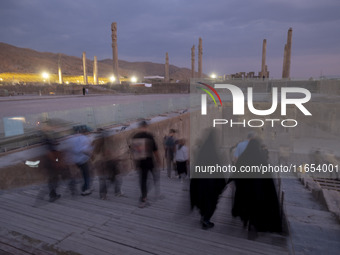 Iranian people visit the Persepolis historical site near the city of Shiraz in Fars province, about 932 km (579 miles) south of Tehran, Iran...