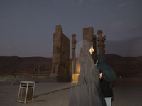 A veiled Iranian woman visits the Persepolis historical site near the city of Shiraz in Fars province, about 932 km (579 miles) south of Teh...