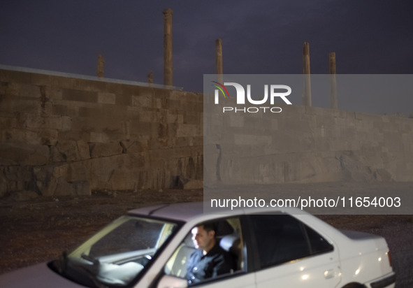 An Iranian man sits in his vehicle at the Persepolis historical site near the city of Shiraz in Fars province, about 932 km (579 miles) sout...