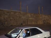 An Iranian man sits in his vehicle at the Persepolis historical site near the city of Shiraz in Fars province, about 932 km (579 miles) sout...