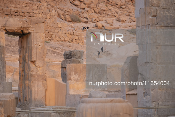 Iranian people visit the Persepolis historical site near the city of Shiraz in Fars province, about 932 km (579 miles) south of Tehran, Iran...