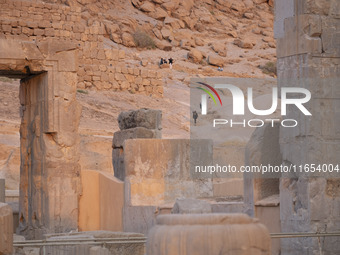 Iranian people visit the Persepolis historical site near the city of Shiraz in Fars province, about 932 km (579 miles) south of Tehran, Iran...