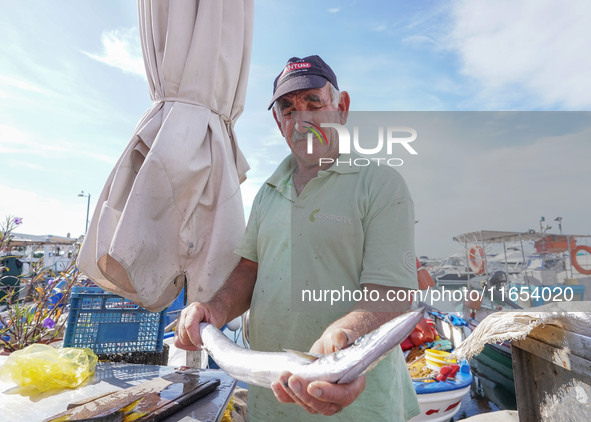 A fisherman is seen in Glyfada in Athens, Greece, on October 10, 2024. 