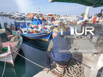 A fisherman is seen in Glyfada in Athens, Greece, on October 10, 2024. (