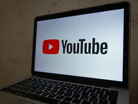 A YouTube logo displayed on a laptop screen is seen in L’Aquila, Italy, on October 9th, 2024. (