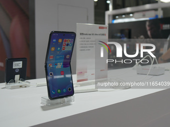 Mobile phone products are displayed at the International Consumer Electronics Show in Shanghai, China, on October 10, 2024. (