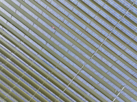 A worker checks photovoltaic equipment at a fishery-solar hybrid base in Suqian, China, on October 10, 2024. (