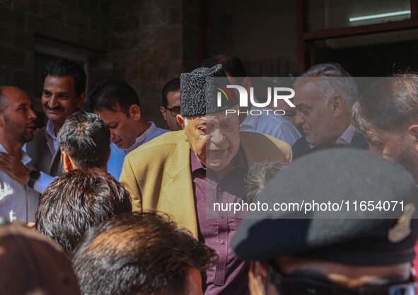 Former chief minister of Jammu and Kashmir and Jammu and Kashmir National Conference (JKNC) party president Farooq Abdullah (Center) stands...