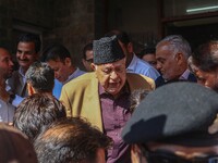 Former chief minister of Jammu and Kashmir and Jammu and Kashmir National Conference (JKNC) party president Farooq Abdullah (Center) stands...