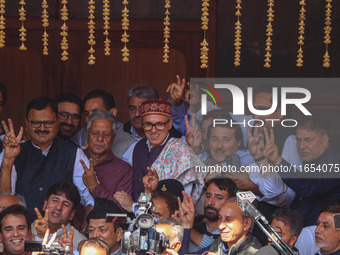 Jammu and Kashmir National Conference (JKNC) party leader Omar Abdullah (center) looks on after a meeting at JKNC headquarters in Srinagar,...