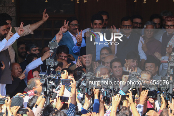 Former chief minister of Jammu and Kashmir and Jammu and Kashmir National Conference (JKNC) party president Farooq Abdullah (Center) stands...