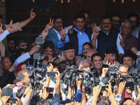 Former chief minister of Jammu and Kashmir and Jammu and Kashmir National Conference (JKNC) party president Farooq Abdullah (Center) stands...