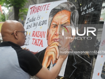 A teacher at Gurukul Art School paints a mural of Ratan Tata as a tribute in Mumbai, India, on October 10, 2024. Ratan Tata is the businessm...