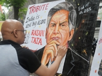 A teacher at Gurukul Art School paints a mural of Ratan Tata as a tribute in Mumbai, India, on October 10, 2024. Ratan Tata is the businessm...