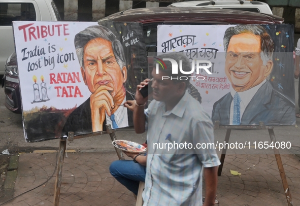 A teacher at Gurukul Art School paints a mural of Ratan Tata as a tribute in Mumbai, India, on October 10, 2024. Ratan Tata is the businessm...