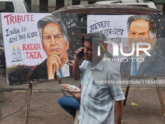 A teacher at Gurukul Art School paints a mural of Ratan Tata as a tribute in Mumbai, India, on October 10, 2024. Ratan Tata is the businessm...