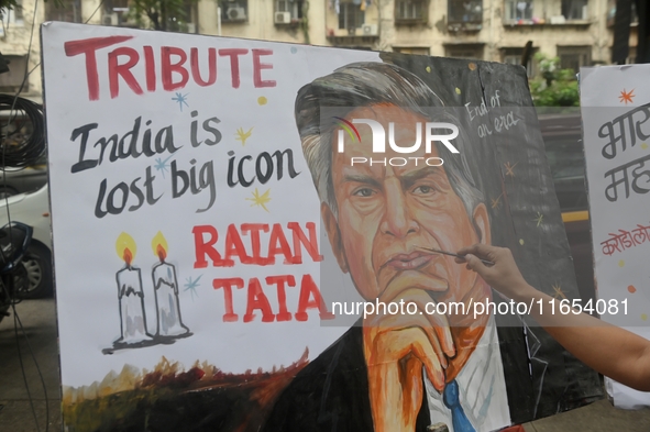 A teacher at Gurukul Art School paints a mural of Ratan Tata as a tribute in Mumbai, India, on October 10, 2024. Ratan Tata is the businessm...