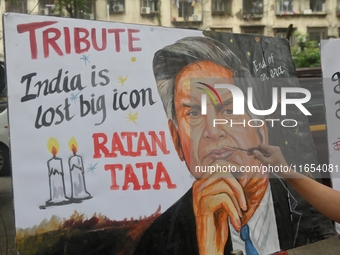 A teacher at Gurukul Art School paints a mural of Ratan Tata as a tribute in Mumbai, India, on October 10, 2024. Ratan Tata is the businessm...